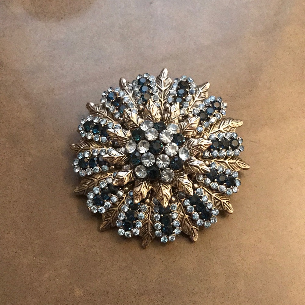 Light and dark blue rhinestone brooch.